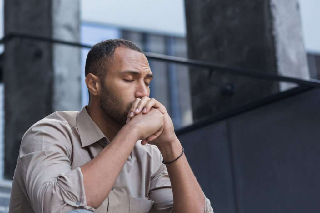 Close-up photo portrait of upset office worker fired businessman in depression, man with closed eyes